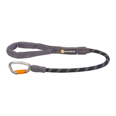 Close-up of the Ruffwear Knot-a-Long rope in Obsidian Black showing the kernmantle weave in daylight (top) and reflective threads illuminated in low light (bottom)