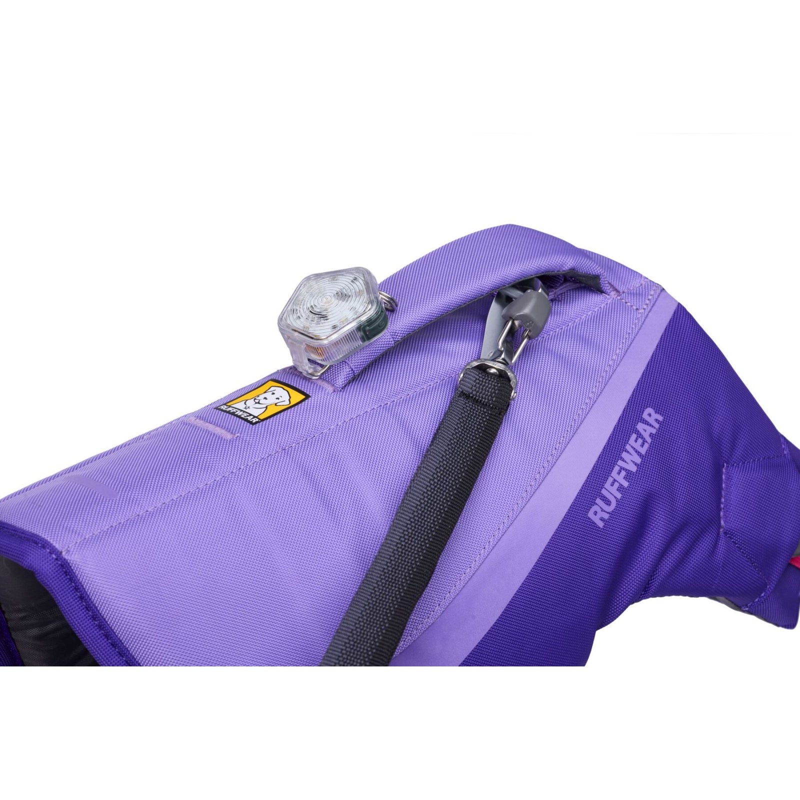 Close-up of the Ruffwear Float Coat handle, leash attachment point, and beacon light loop detail in Purple Lily.