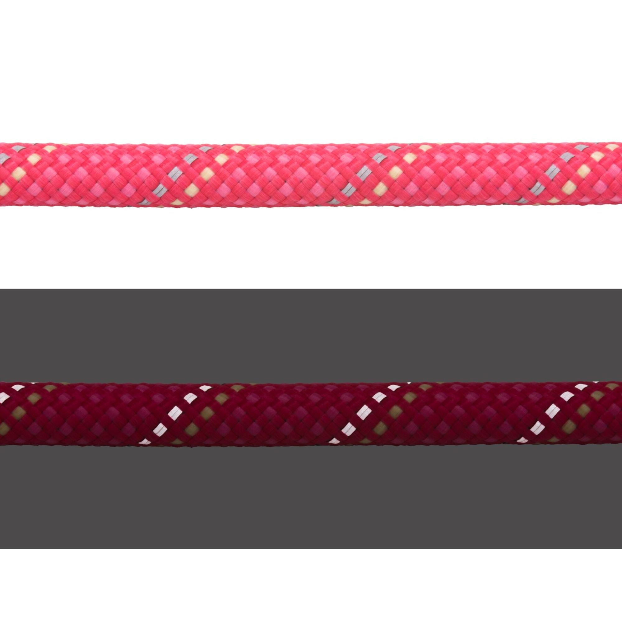 Close-up of the Ruffwear Knot-a-Long rope in Fireweed Pink showing the kernmantle weave in daylight (top) and reflective threads illuminated in low light (bottom)