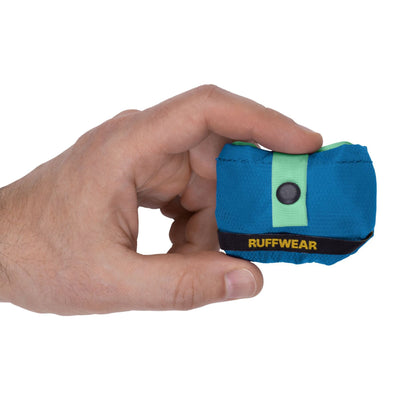 Hand holding a Ruffwear Trail Runner Bowl in Blue Pool, collapsed, showing size