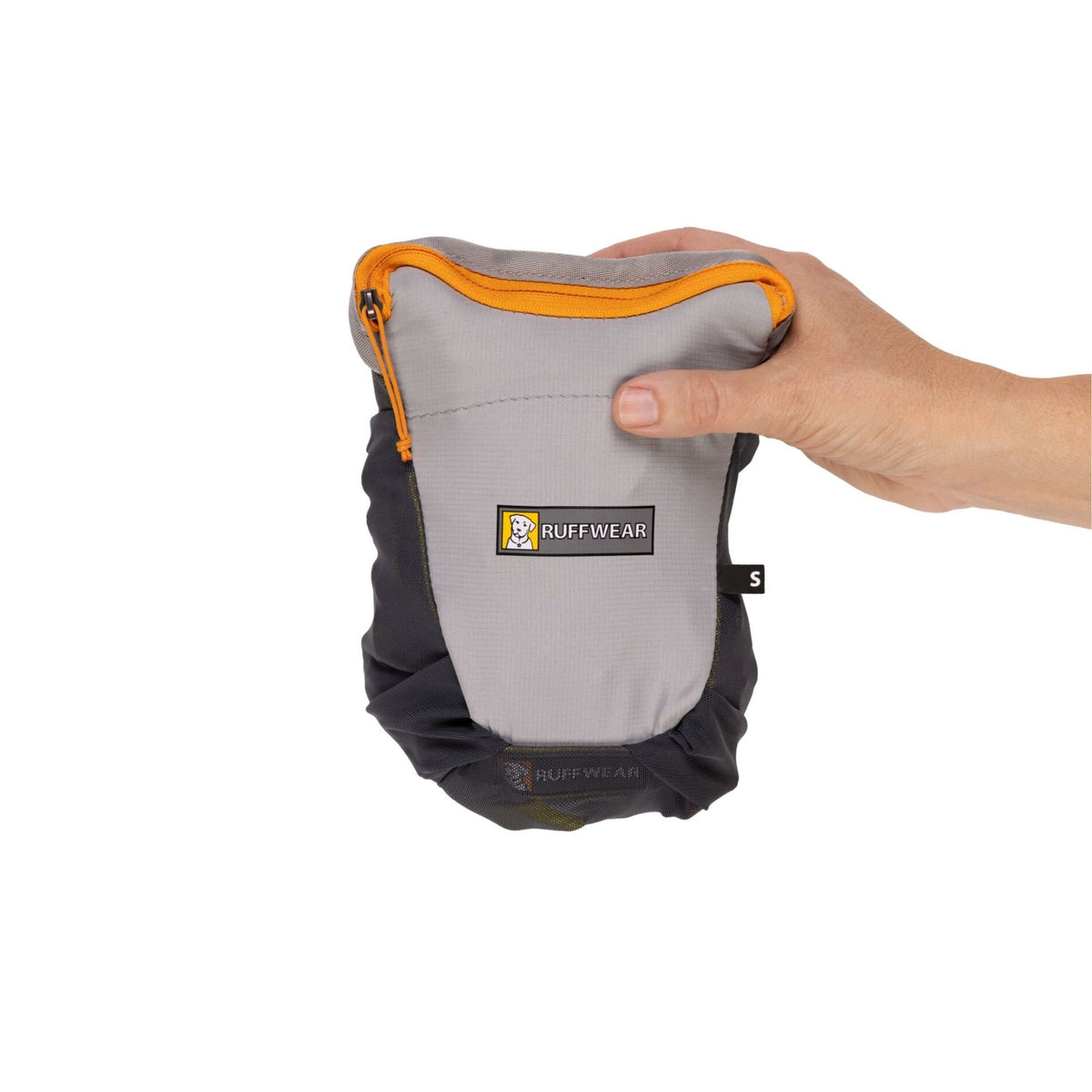 Ruffwear BackTrak Evac Kit in Cloudburst Gray packed into its own mesh stow pocket, held in one hand to show compact size, white background