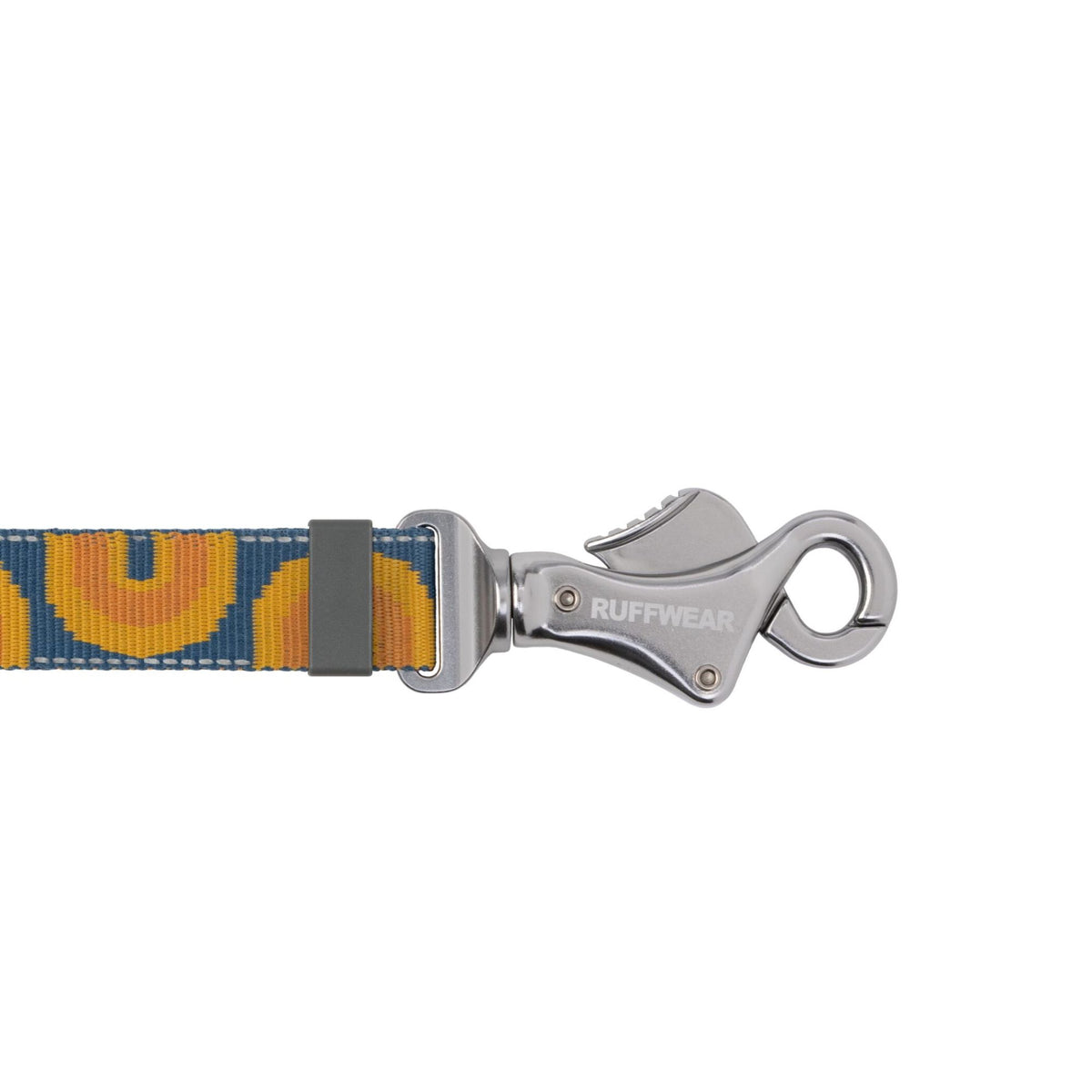 Close-up of the Ruffwear clip on the Crag Lead in Canyon Oxbow, showing the engraved Ruffwear logo on the polished aluminium hardware and the webbing adjuster detail.
